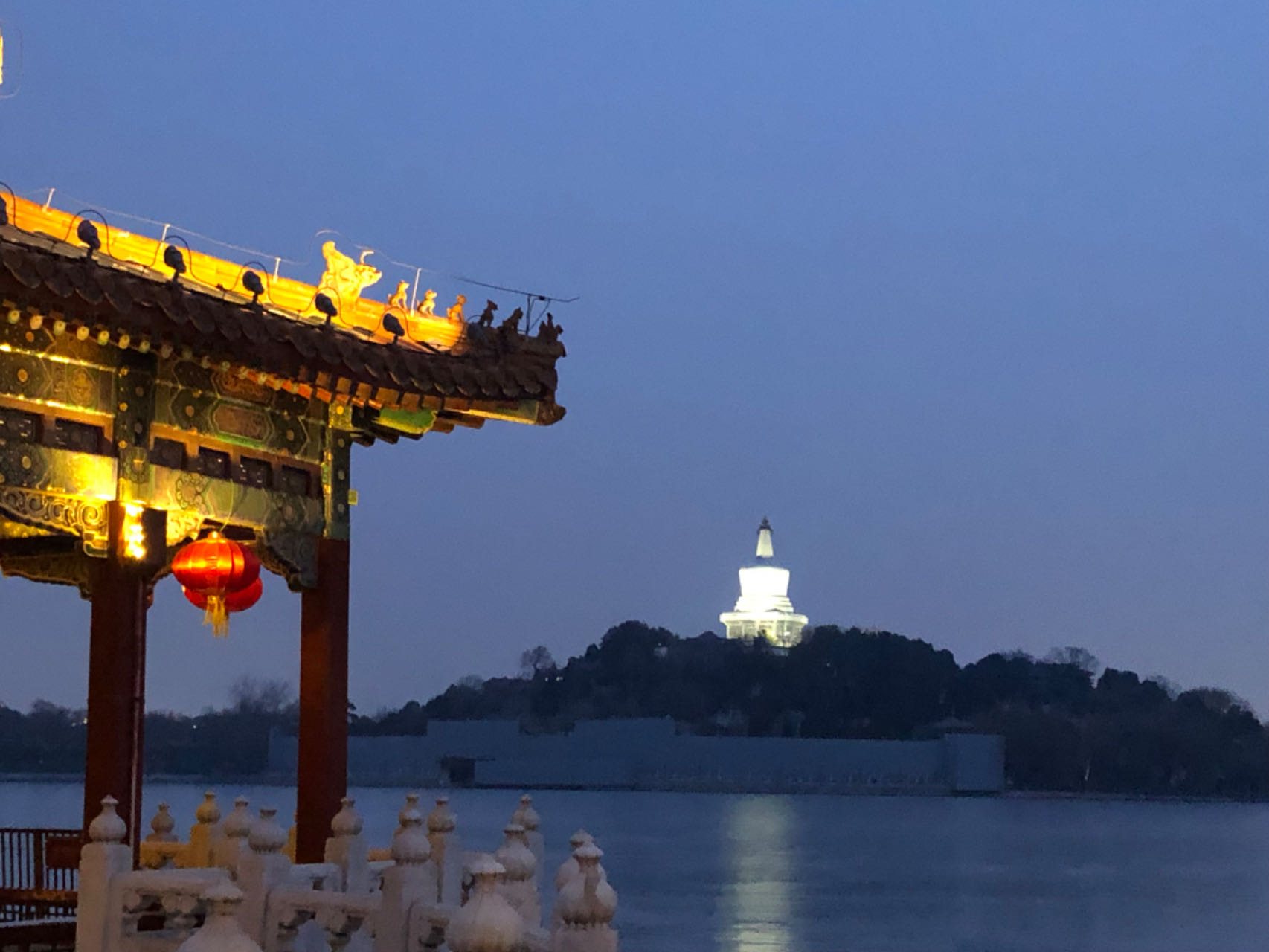 Beijing evening scene with illuminated white pagoda